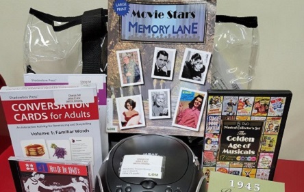 memory kit showing items coversation cards for adults, cd player, dvd, cd, 1950 movie star book.