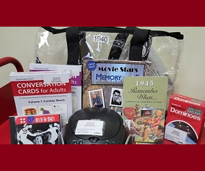 Memory kit items - cd player, books, cd, dvd, domino game and conversation cards.