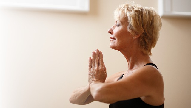 woman sits in yoga pose