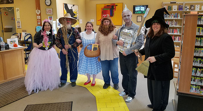 Staff dressed in costumes from the Wizard of Oz at Fort Bragg Library.
