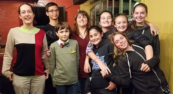 Group of teens posing at the Fort Bragg Library.